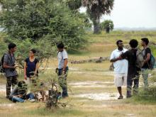 Participants comparing notes after the bird trip