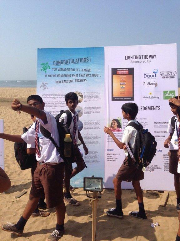 Students at the art installation on Miramar Beach.