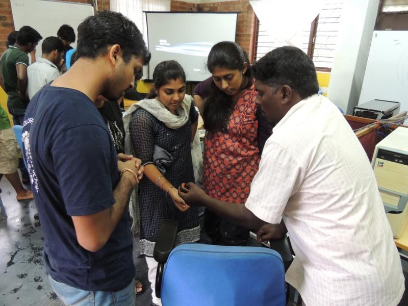 Saravanan demonstrating the use of a GPS unit.